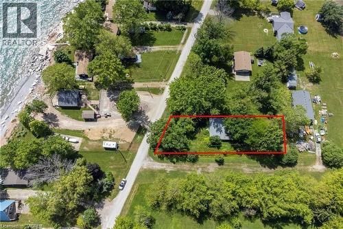 Aerial perspective showcasing a property parcel with extensive tree coverage - 28 Derner Line, Lowbanks, ON - Outdoor With View