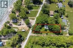 Aerial perspective showcasing a property parcel with extensive tree coverage - 