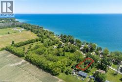Expansive property featuring direct water frontage with vibrant blue water - 