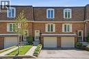 Brick facade townhome with a gambrel roof and dormer windows - 1526 Westminster Place, Burlington, ON  - Outdoor With Facade 