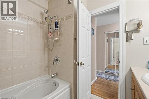 Bathroom featuring a white bathtub with a chrome fixture set and an overhead shower - 1526 Westminster Place, Burlington, ON - Indoor Photo Showing Bathroom