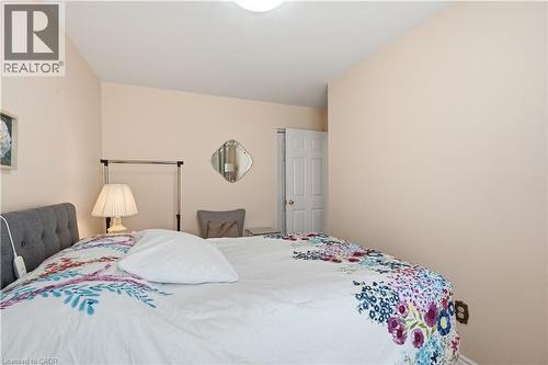Bedroom featuring light peach walls, a white ceiling, and a white interior door - 1526 Westminster Place, Burlington, ON - Indoor Photo Showing Bedroom
