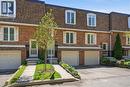 Brick townhouse exterior with a mansard roof - 1526 Westminster Place, Burlington, ON  - Outdoor With Facade 