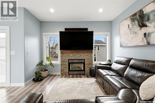 709 Aspen Crescent, Pilot Butte, SK - Indoor Photo Showing Living Room With Fireplace