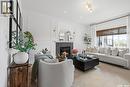 5018 Padwick Road, Regina, SK  - Indoor Photo Showing Living Room With Fireplace 