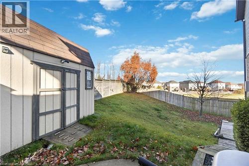 Exterior storage shed featuring a gambrel roof and double doors - 27 Red Clover Crescent, Kitchener, ON - Outdoor