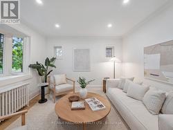 33 MORTIMER AVENUE Toronto, ON M4K 1Z9