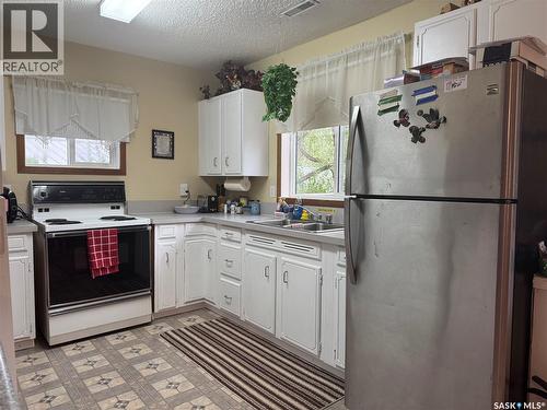 23 Lynn Bay, Last Mountain Lake East Side, SK - Indoor Photo Showing Kitchen With Double Sink