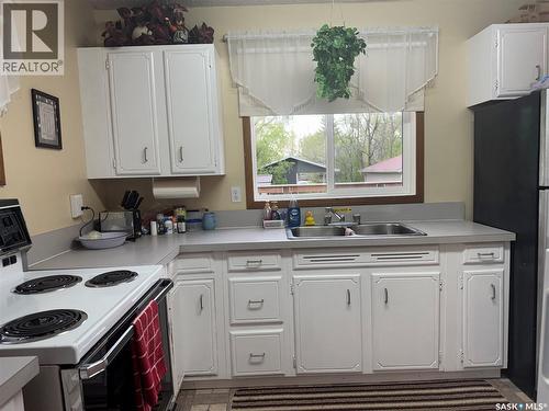 23 Lynn Bay, Last Mountain Lake East Side, SK - Indoor Photo Showing Kitchen With Double Sink