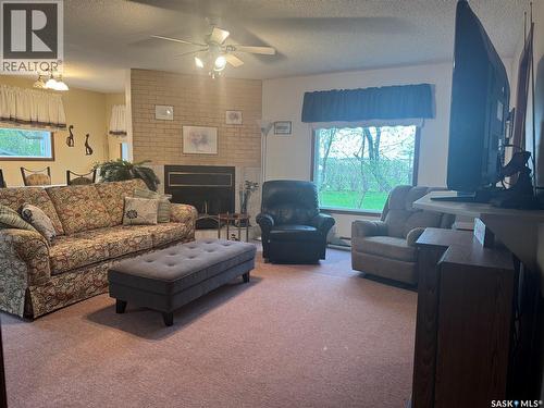 23 Lynn Bay, Last Mountain Lake East Side, SK - Indoor Photo Showing Living Room With Fireplace