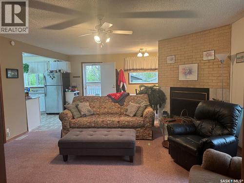 23 Lynn Bay, Last Mountain Lake East Side, SK - Indoor Photo Showing Living Room With Fireplace
