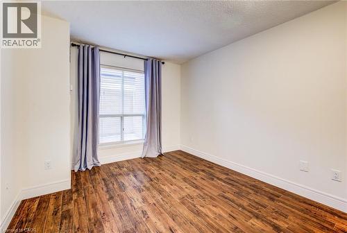 Large window in the bedroom - 1414 King Street E Unit# 101, Kitchener, ON - Indoor Photo Showing Other Room