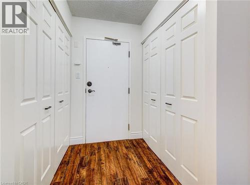 Spacious entrance with laundry and double closet - 1414 King Street E Unit# 101, Kitchener, ON - Indoor Photo Showing Other Room