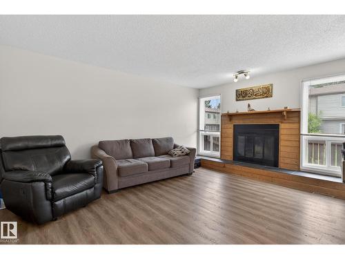 #53 7604 29 Av Nw, Edmonton, AB - Indoor Photo Showing Living Room With Fireplace