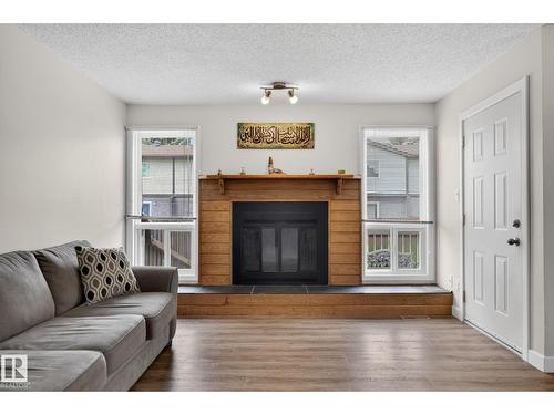 #53 7604 29 Av Nw, Edmonton, AB - Indoor Photo Showing Living Room With Fireplace