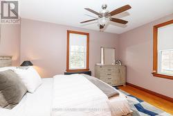 The primary bedroom overlooks the back & side yard - 