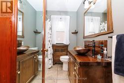 Stunning updated bath with live-edge wood details - 