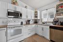 52 William Whiteway Bay, Winnipeg, MB  - Indoor Photo Showing Kitchen With Double Sink 