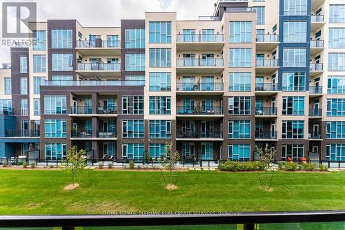 213 - 10 Concord Place, Grimsby, ON - Outdoor With Facade