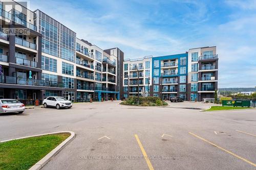 213 - 10 Concord Place, Grimsby, ON - Outdoor With Facade