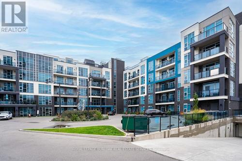 213 - 10 Concord Place, Grimsby, ON - Outdoor With Facade