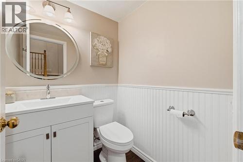 Bathroom vanity with integrated sink, chrome faucet, and white cabinetry - 245 Bishop Street S Unit# 31, Cambridge, ON - Indoor Photo Showing Bathroom