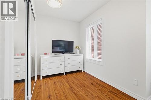 Wood-finish flooring throughout, complemented by white baseboards and trim - 245 Bishop Street S Unit# 31, Cambridge, ON - Indoor