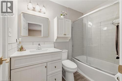 Bathroom featuring a single vanity with storage, white countertop, and a chrome faucet - 245 Bishop Street S Unit# 31, Cambridge, ON - Indoor Photo Showing Bathroom