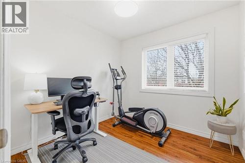Bright room with wood-finish flooring and a large window featuring blinds - 245 Bishop Street S Unit# 31, Cambridge, ON - Indoor Photo Showing Other Room