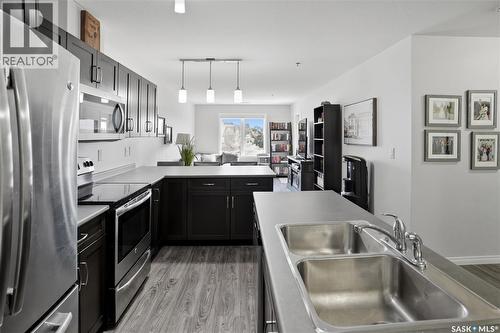 305 2452 Killdeer Drive, North Battleford, SK - Indoor Photo Showing Kitchen With Stainless Steel Kitchen With Double Sink With Upgraded Kitchen