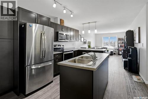 305 2452 Killdeer Drive, North Battleford, SK - Indoor Photo Showing Kitchen With Stainless Steel Kitchen With Double Sink With Upgraded Kitchen