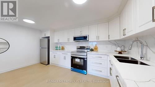 106 - 1445 Wilson Avenue, Toronto, ON - Indoor Photo Showing Kitchen With Double Sink