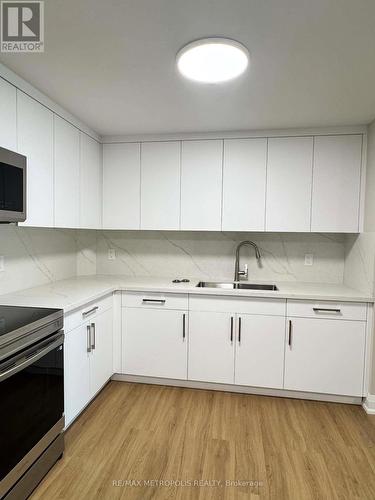 106 - 1445 Wilson Avenue, Toronto, ON - Indoor Photo Showing Kitchen With Double Sink