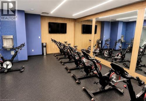 Dedicated spin room featuring multiple exercise bikes - 75 James Street S Unit# 2614, Hamilton, ON - Indoor Photo Showing Gym Room
