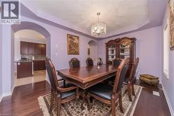 Formal dining area featuring hardwood flooring - 