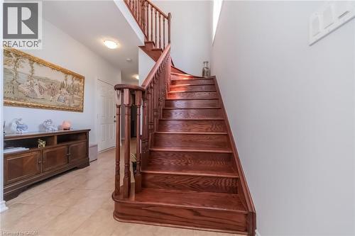 Hardwood staircase with turned newel posts and balusters - 675 Best Road, Milton, ON - Indoor Photo Showing Other Room