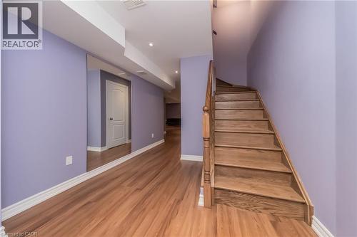 Hardwood flooring throughout the hallway and staircase - 675 Best Road, Milton, ON - Indoor Photo Showing Other Room