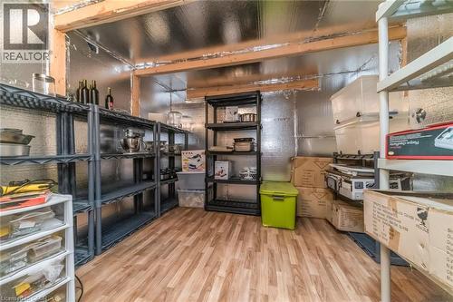 Utility room featuring wood-finish flooring and reflective wall insulation - 675 Best Road, Milton, ON - Indoor