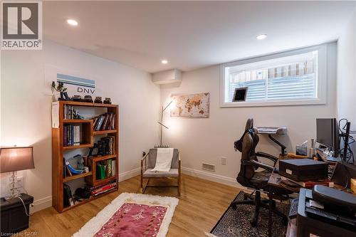 Versatile room featuring recessed ceiling lighting, a wood-finish flooring, and a window with white trim - 916 Steepleridge Court, Kitchener, ON - Indoor Photo Showing Office