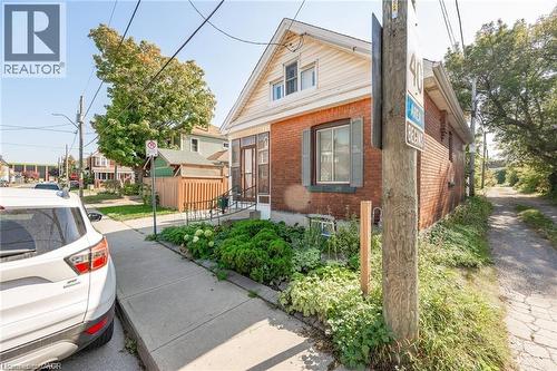 Brick exterior with white siding accents and a covered front porch entry - 252 Beechwood Avenue, Hamilton, ON - Outdoor