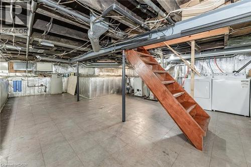 Unfinished basement with concrete flooring and exposed structural beams - 252 Beechwood Avenue, Hamilton, ON - Indoor