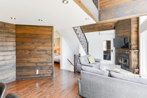 Vue d'ensemble - 100 Rue Du Golf, Saint-Côme, QC - Indoor Photo Showing Living Room With Fireplace