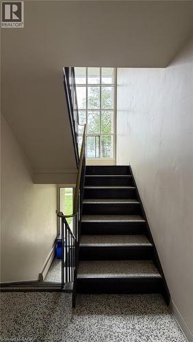 Stairwell featuring a multi-paned window - 206 Indian Road, Kitchener, ON - Indoor Photo Showing Other Room