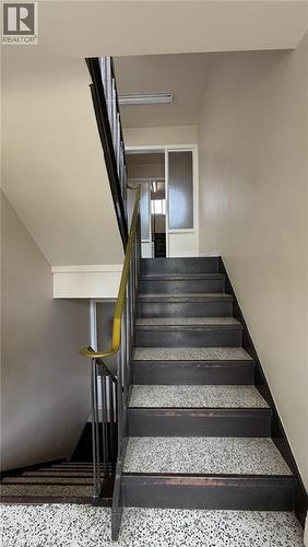 Staircase featuring dark wood risers and speckled treads - 206 Indian Road, Kitchener, ON - Indoor Photo Showing Other Room