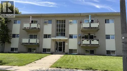 Three-story multi-family building with brick exterior and recessed balconies - 206 Indian Road, Kitchener, ON - Outdoor With Facade