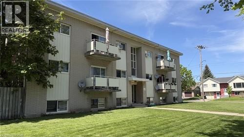 Multi-story building featuring brick and vertical panel siding - 206 Indian Road, Kitchener, ON - Outdoor