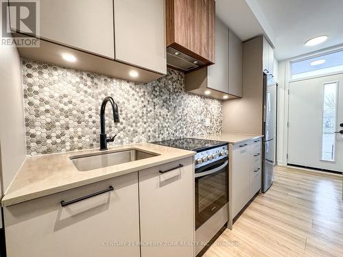 06 - 20 Lagerfeld Drive, Brampton, ON - Indoor Photo Showing Kitchen With Upgraded Kitchen
