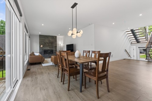Dining Room - 3 Rue Thomas-Dennis, Notre-Dame-De-L'Île-Perrot, QC - Indoor Photo Showing Dining Room With Fireplace
