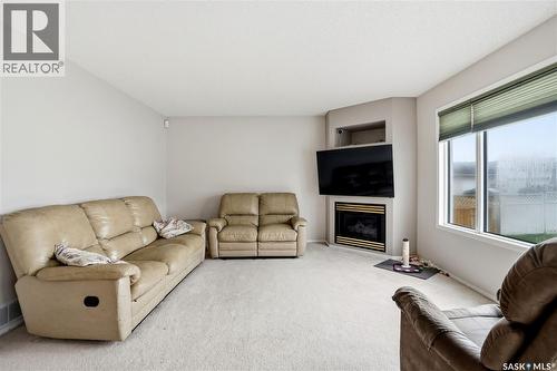 1204 Boehm Bay N, Regina, SK - Indoor Photo Showing Living Room With Fireplace