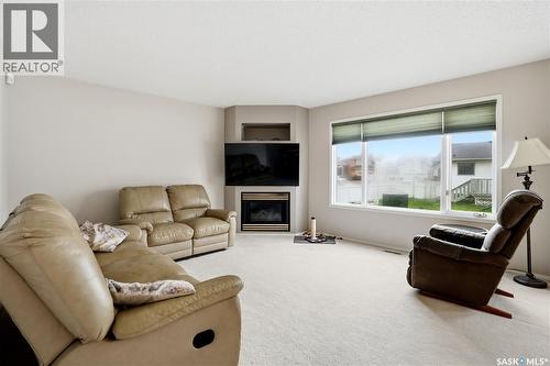 1204 Boehm Bay N, Regina, SK - Indoor Photo Showing Living Room With Fireplace